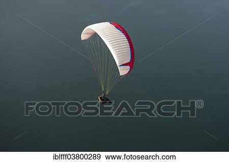 "Paragliding, paraglider flying over Lake Garda, Veneto, Italy, Europe" View Large Photo Image Stock Photo - "Paragliding, paraglider flying over Lake Garda, Veneto, Italy, Europe". Fotosearch