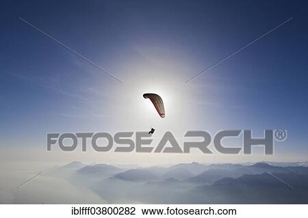 "Paragliding, paraglider, haze, sun, Lake Garda, Veneto, Italy, Europe" View Large Photo Image Stock Image - "Paragliding, paraglider, haze, sun, Lake Garda, Veneto, Italy, Europe". Fotosearch