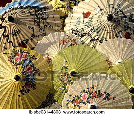 Stock Image - "Parasol painting, paper parasols with floral designs, Bo Sang, Chiang Mai, Northern Thailand, Thailand, Asia". Fotosearch