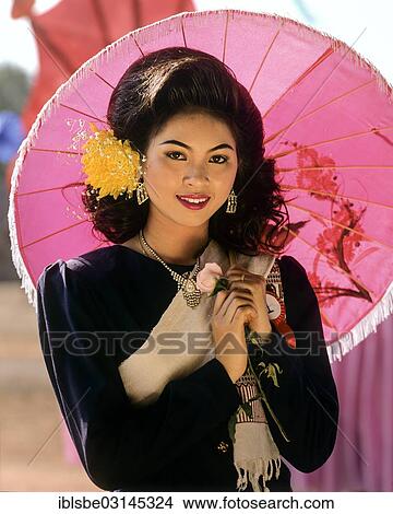 "Parasol painting, young woman holding a silk parasol during a parasol festival, Bo Sang, Chiang Mai, Northern Thailand, Thailand, Asia" View Large Photo Image Picture - "Parasol painting, young woman holding a silk parasol during a parasol festival, Bo Sang, Chiang Mai, Northern Thailand, Thailand, Asia". Fotosearch