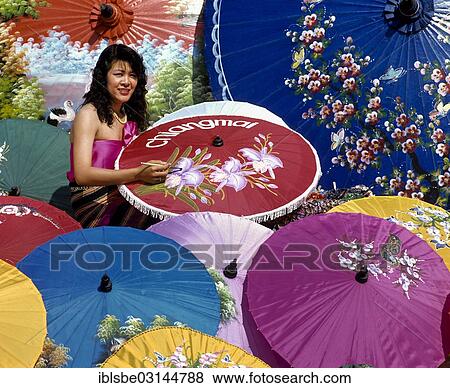 Stock Photo - "Parasol painting, young woman painting silk parasols, Bo Sang, Chiang Mai, Northern Thailand, Thailand, Asia". Fotosearch