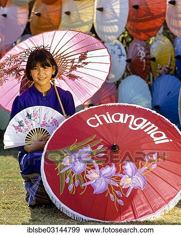 Stock Photo - "Parasol painting, young woman with silk parasols, Bo Sang, Chiang Mai, Northern Thailand, Thailand, Asia". Fotosearch
