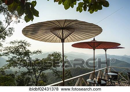 "Parasols on cafe terrace with a view, Temple complex of Wat Phra That Doi Kong Mu, Mae Hong Son, Northern Thailand, Thailand, Asia" View Large Photo Image Stock Photo - "Parasols on cafe terrace with a view, Temple complex of Wat Phra That Doi Kong Mu, Mae Hong Son, Northern Thailand, Thailand, Asia". Fotosearch