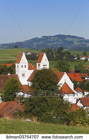Stock Photo - "Parish Church of St. John the Baptist, in front of Auersberg Mountain, Steingaden, Pfaffenwinkel region, Upper Bavaria, Bavaria, Germany, Europe". Fotosearch