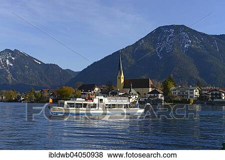 "Parish Church of St. Lawrence and motorboat in front of Bodenschneid, Stumpfling and Wallberg mountains, lake Tegernsee, Egern, Rottach-Egern, Upper Bavaria, Bavaria, Germany, Europe" View Large Photo Image Stock Photo - "Parish Church of St. Lawrence and motorboat in front of Bodenschneid, Stumpfling and Wallberg mountains, lake Tegernsee, Egern, Rottach-Egern, Upper Bavaria, Bavaria, Germany, Europe". Fotosearch