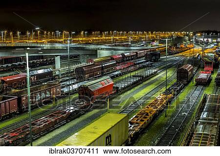 "Parked goods wagons on the tracks of the Maschen marshalling yard at night, Maschen, Lower Saxony, Germany, Europe" View Large Photo Image Stock Image - "Parked goods wagons on the tracks of the Maschen marshalling yard at night, Maschen, Lower Saxony, Germany, Europe". Fotosearch