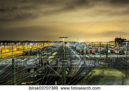 Stock Photo - "Parked goods wagons on the tracks of the Maschen marshalling yard at night, Maschen, Lower Saxony, Germany, Europe". Fotosearch