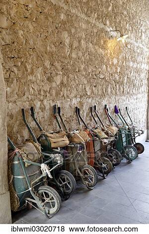 Stock Photo - "Parking for wheelbarrows, push carts, principal means of transportation in the Souq al Waqif, oldest souq or bazaar in the country, Doha, Doha, Qatar, Asia". Fotosearch