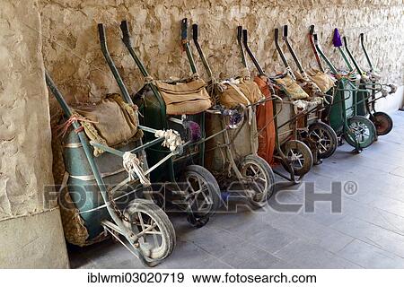 Stock Photo - "Parking for wheelbarrows, push carts, main means of transport in the Souq al Waqif, oldest souq or bazaar in the country, Doha, Doha, Qatar, Asia". Fotosearch