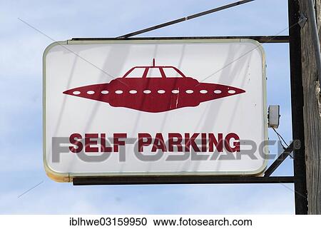 Stock Image - "Parking sign for UFOs at the """"Little A'Le'Inn"""" pub, Rachel, Rachel, Nevada, United States, North America". Fotosearch