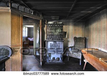 "Parlour with a tiled stove, furnished as in 1900, in a farmhouse originally from Herrnbechtheim, built in 1772, relocated to the Franconian Open Air Museum in Bad Windsheim, Middle Franconia, Bavaria, Germany, Europe" View Large Photo Image Stock Photo - "Parlour with a tiled stove, furnished as in 1900, in a farmhouse originally from Herrnbechtheim, built in 1772, relocated to the Franconian Open Air Museum in Bad Windsheim, Middle Franconia, Bavaria, Germany, Europe". Fotosearch