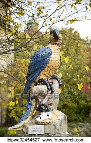 Stock Photo - "Parrot as a porcelain figure from the Nymphenburg Porcelain Manufactory, Botanical Garden, Munich, Bavaria, Germany, Europe". Fotosearch