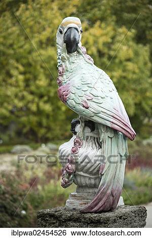 Stock Photograph - "Parrot as a porcelain figure from the Nymphenburg Porcelain Manufactory, Botanical Garden, Munich, Bavaria, Germany, Europe". Fotosearch