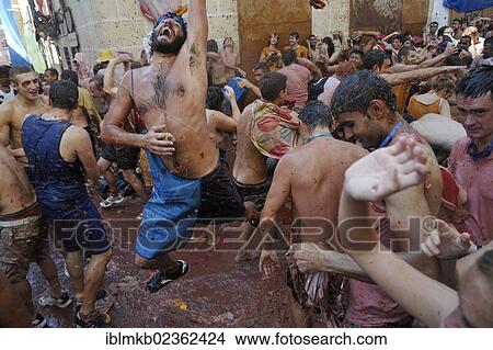 "Participants throwing clothes soaked in tomato juice, Tomatina tomato festival, Bunol, Spain, Europe" View Large Photo Image Picture - "Participants throwing clothes soaked in tomato juice, Tomatina tomato festival, Bunol, Spain, Europe". Fotosearch