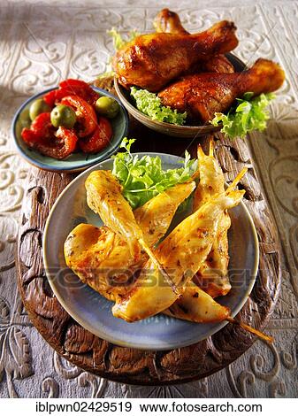 Party buffet food with chicken satay and BBQ drum sticks View Large Photo Image Stock Photo - Party buffet food with chicken satay and BBQ drum sticks. Fotosearch