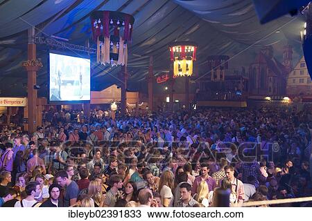 Stock Image - "Party in a beer tent, Cannstatter Wasen fairground, funfair, Bad Cannstatt, Stuttgart, Baden-Wuerttemberg, Germany, Europe". Fotosearch