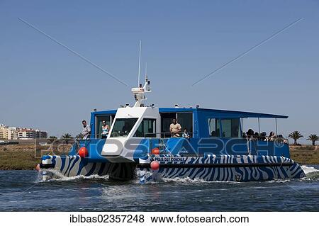"Passenger ferry to outlying islands in the Ria Formosa Natural Park Laguna, Faro, Algarve, Portugal, Europe" View Large Photo Image Stock Photo - "Passenger ferry to outlying islands in the Ria Formosa Natural Park Laguna, Faro, Algarve, Portugal, Europe". Fotosearch