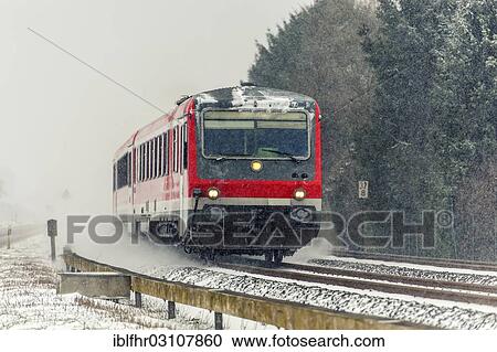 "Passenger train in winter during snowfall, Grevenbroich, Rhineland, North Rhine-Westphalia, Germany, Europe" View Large Photo Image Stock Image - "Passenger train in winter during snowfall, Grevenbroich, Rhineland, North Rhine-Westphalia, Germany, Europe". Fotosearch