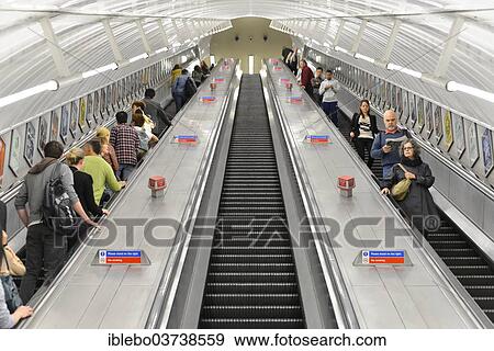 Stock Photo - "Passengers travelling on escalators at an underground station, London Underground, London, London region, England, United Kingdom, Europe". Fotosearch