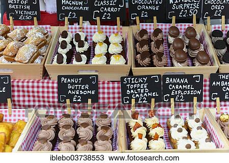 Stock Image - "Pastries on sale at a market stall in Covent Garden, London, London region, England, United Kingdom, Europe". Fotosearch