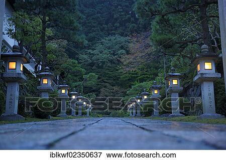 "Path to a monastery in the evening lit by stone lanterns, Koya-san, Wakayama, near Osaka, Japan, East Asia, Asia" View Large Photo Image Stock Photo - "Path to a monastery in the evening lit by stone lanterns, Koya-san, Wakayama, near Osaka, Japan, East Asia, Asia". Fotosearch