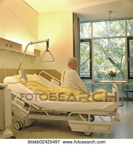 "Patient, from behind, sitting on a hospital bed" View Large Photo Image Stock Photo - "Patient, from behind, sitting on a hospital bed". Fotosearch