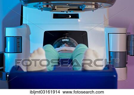 Picture - "Patient lying in a linear particle accelerator for radiation treatment, Germany, Europe". Fotosearch