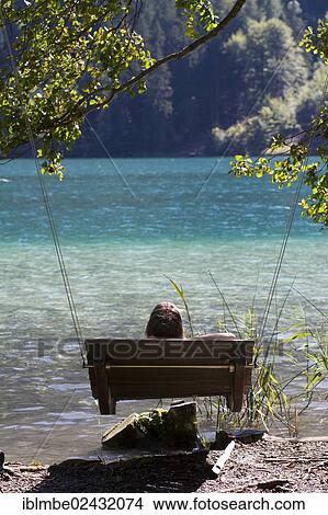 "Patio swing at a public bathing spot on the east end of Weissensee lake, Carinthia, Austria, Europe" View Large Photo Image Picture - "Patio swing at a public bathing spot on the east end of Weissensee lake, Carinthia, Austria, Europe". Fotosearch