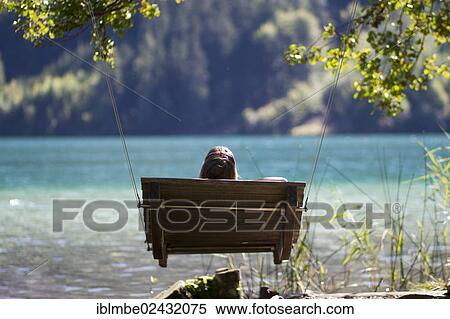 "Patio swing at a public bathing spot on the east end of Weissensee lake, Carinthia, Austria, Europe" View Large Photo Image Stock Photography - "Patio swing at a public bathing spot on the east end of Weissensee lake, Carinthia, Austria, Europe". Fotosearch