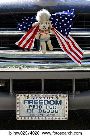 Stock Photo - "Patriotic radiator adornment of a motor vehicle, """"Freedom paid for in blood"""" licence plate, Grand Staircase-Escalante National Monument, GSENM, Utah, Southwestern United States, USA". Fotosearch