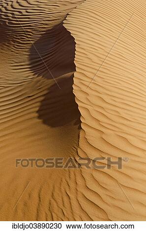 "Patterns of the sand dunes of the Wahiba Sands desert, also known as Ramlat al-Wahiba or Sharqiya Sands, in evening light, Hawiyah, Ash Sharqiyah, Oman, Asia" View Large Photo Image Stock Image - "Patterns of the sand dunes of the Wahiba Sands desert, also known as Ramlat al-Wahiba or Sharqiya Sands, in evening light, Hawiyah, Ash Sharqiyah, Oman, Asia". Fotosearch