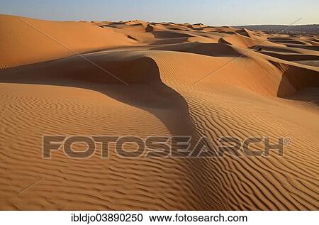"Patterns of the sand dunes of the Wahiba Sands desert, also known as Ramlat al-Wahiba or Sharqiya Sands, in evening light, Hawiyah, Ash Sharqiyah, Oman, Asia" View Large Photo Image Stock Image - "Patterns of the sand dunes of the Wahiba Sands desert, also known as Ramlat al-Wahiba or Sharqiya Sands, in evening light, Hawiyah, Ash Sharqiyah, Oman, Asia". Fotosearch