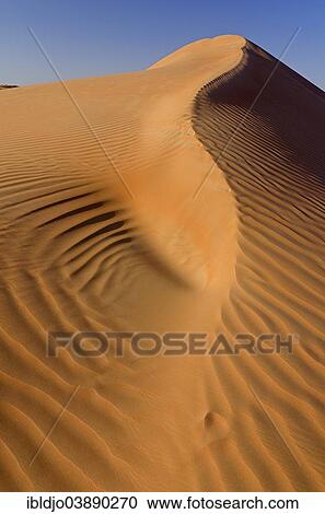 "Patterns of the sand dunes of the Wahiba Sands desert, also known as Ramlat al-Wahiba or Sharqiya Sands, in morning light, Hawiyah, Ash Sharqiyah, Oman, Asia" View Large Photo Image Stock Image - "Patterns of the sand dunes of the Wahiba Sands desert, also known as Ramlat al-Wahiba or Sharqiya Sands, in morning light, Hawiyah, Ash Sharqiyah, Oman, Asia". Fotosearch