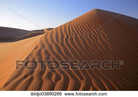 "Patterns of the sand dunes of the Wahiba Sands desert, also known as Ramlat al-Wahiba or Sharqiya Sands, in morning light, Hawiyah, Ash Sharqiyah, Oman, Asia" View Large Photo Image Stock Photograph - "Patterns of the sand dunes of the Wahiba Sands desert, also known as Ramlat al-Wahiba or Sharqiya Sands, in morning light, Hawiyah, Ash Sharqiyah, Oman, Asia". Fotosearch
