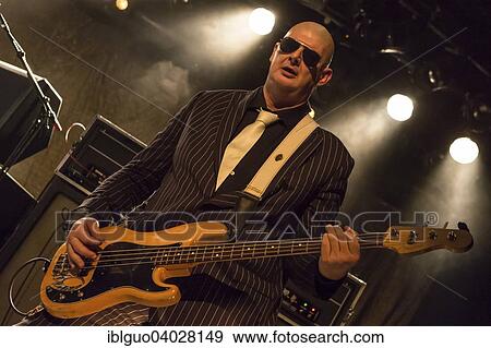 Stock Photo - "Paul Van Bruystegem, bass player of the Belgian rock band Triggerfinger, live in the Schuur, Lucerne, Switzerland Switzerland". Fotosearch