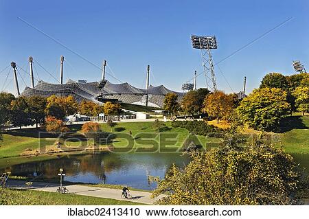 Pavilion-roof of the Olympic Hall, floodlights and lake Olympiasee, Munich, Bavaria, Germany, Europe View Large Photo Image Stock Image - Pavilion-roof of the Olympic Hall, floodlights and lake Olympiasee, Munich, Bavaria, Germany, Europe. Fotosearch