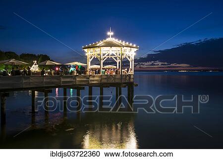 "Pavilion with a bar on Lake Constance in the evening, Bregenz, Vorarlberg, Austria, Europe" View Large Photo Image Stock Image - "Pavilion with a bar on Lake Constance in the evening, Bregenz, Vorarlberg, Austria, Europe". Fotosearch