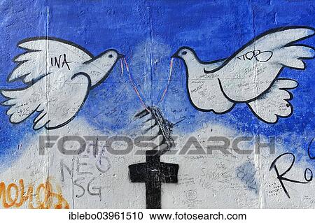 "Peace doves on a remaining piece of the Berlin Wall, painting by Rosemarie Schinzler, East Side Gallery, Berlin-Friedrichshain, Berlin, Germany, Europe" View Large Photo Image Stock Image - "Peace doves on a remaining piece of the Berlin Wall, painting by Rosemarie Schinzler, East Side Gallery, Berlin-Friedrichshain, Berlin, Germany, Europe". Fotosearch