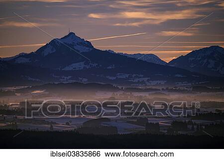 "Peak of Mt Grunten with the Alpine foothills at sunset, Auerberg, Ostallgau, Bavaria, Germany, Europe" View Large Photo Image Stock Photograph - "Peak of Mt Grunten with the Alpine foothills at sunset, Auerberg, Ostallgau, Bavaria, Germany, Europe". Fotosearch