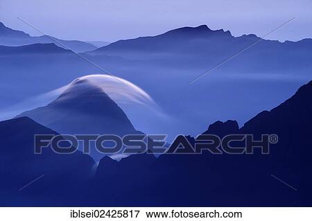 "Peaks at the blue hour with rolling cloud, Lenticularis, Warth, Vorarlberg, Austria, Europe" View Large Photo Image Stock Photo - "Peaks at the blue hour with rolling cloud, Lenticularis, Warth, Vorarlberg, Austria, Europe". Fotosearch