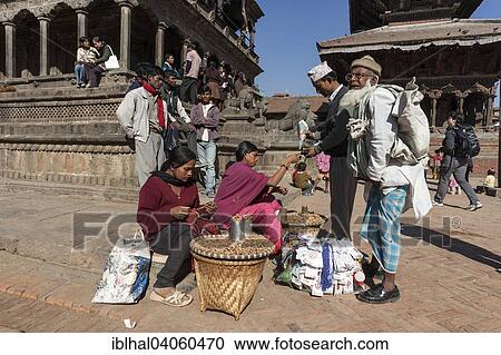 "Peanut sellers in front of the Krishna Temple, Durbar Square, Ppatan, Nepal, Asia" View Large Photo Image Stock Image - "Peanut sellers in front of the Krishna Temple, Durbar Square, Ppatan, Nepal, Asia". Fotosearch