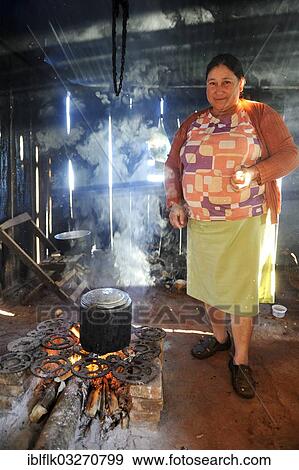 "Peasant farmer, 47, cooking over an open fire, Pastoreo, Caaguazu Department, Paraguay, South America" View Large Photo Image Stock Photo - "Peasant farmer, 47, cooking over an open fire, Pastoreo, Caaguazu Department, Paraguay, South America". Fotosearch