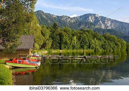 "Pedal boats on the shore of Lake Kochel, Kochel am See, Upper Bavaria, Bavaria, Germany, Europe" View Large Photo Image Stock Photograph - "Pedal boats on the shore of Lake Kochel, Kochel am See, Upper Bavaria, Bavaria, Germany, Europe". Fotosearch