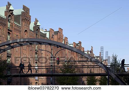 "Pedestrian bridge between the Speicherstadt historic warehouse district and the Sandtorkai, HafenCity, Hamburg, Germany, Europe" View Large Photo Image Stock Image - "Pedestrian bridge between the Speicherstadt historic warehouse district and the Sandtorkai, HafenCity, Hamburg, Germany, Europe". Fotosearch