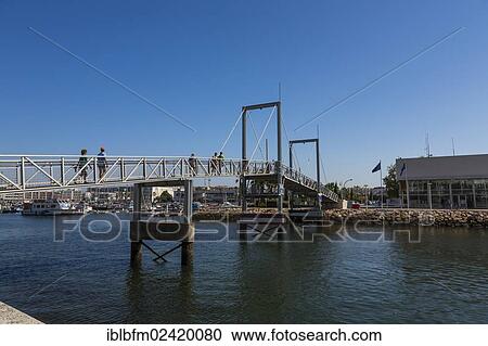 Pedestrian bridge, marina, Lagos, Algarve, Portugal, Europe View Large Photo Image Stock Image - Pedestrian bridge, marina, Lagos, Algarve, Portugal, Europe. Fotosearch