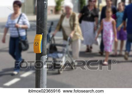 Stock Photograph - "Pedestrian crossing with a signalling box for visually impaired people, Hesse, Germany, Europe". Fotosearch