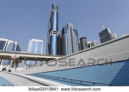 Pedestrian ramp, metro viaduct, skyscrapers, Sheikh Zayed Road, Dubai, United Arab Emirates, Middle East, Asia View Large Photo Image Stock Image - Pedestrian ramp, metro viaduct, skyscrapers, Sheikh Zayed Road, Dubai, United Arab Emirates, Middle East, Asia. Fotosearch