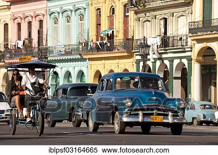 "Pedicab, American classic cars from the '50s and colourful facades, Centro Habana, Havana, Cuba, North America" View Large Photo Image Stock Photography - "Pedicab, American classic cars from the '50s and colourful facades, Centro Habana, Havana, Cuba, North America". Fotosearch