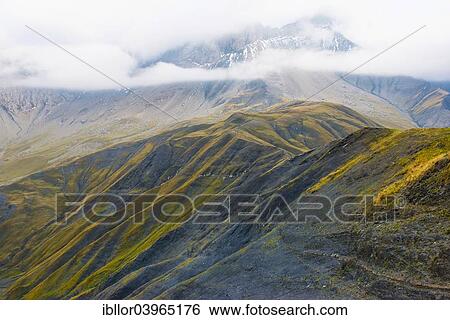 Stock Photograph - "Pelvoux landscape with fog and clouds, Pelvoux, Dauphine Alps, Savoie, France, Europe". Fotosearch