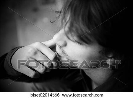 "Pensive young man, portrait" View Large Photo Image Stock Photograph - "Pensive young man, portrait". Fotosearch